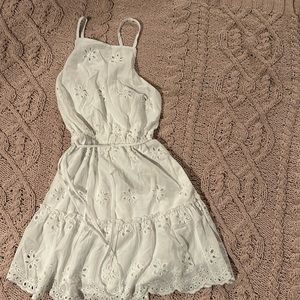Girl’s white dress perfect for Easter with criss cross straps in back.